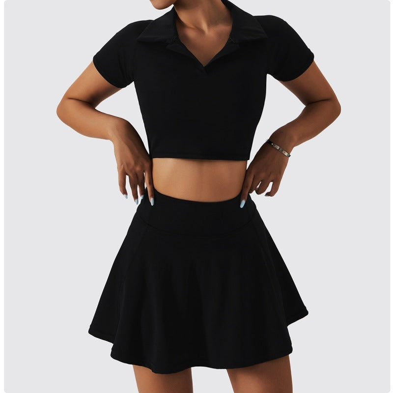 Black cropped collared athletic top paired with a flared mini skirt in a chic two-piece look.